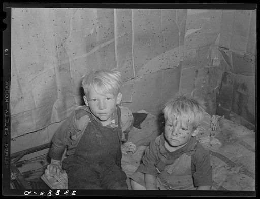 Children of Mays Avenue camp family in small shack used as sleeping quarters. Oklahoma City, Oklahoma. Refer to general caption no. 21