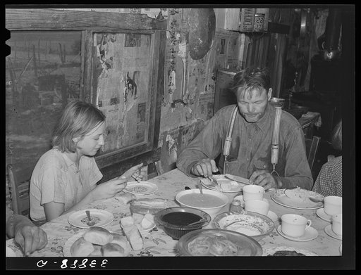 Tenant farmer and daughter at noonday meal. Near Muskogee, Oklahoma. See general caption number 20