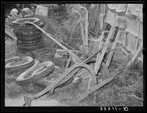 Old plows and wornout tires. Testimonial to the sources of the residents of the community camp. Oklahoma City, Oklahoma. See general caption no. 21