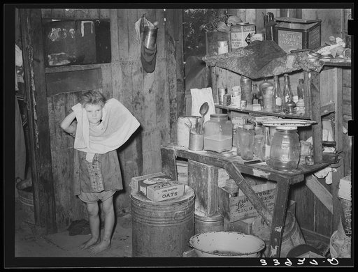 Interior of shack home of family living in camp near Mays Avenue. Oklahoma City, Oklahoma