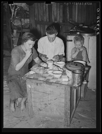 Family eating breakfast. Mays Avenue camp, Oklahoma City, Oklahoma. See general caption no. 21