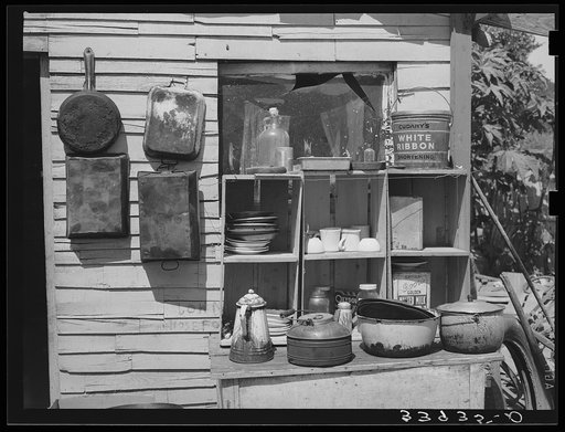Pans and outdoor kitchen cupboard of family living near Mays Avenue camp. Oklahoma City, Oklahoma. See general caption no. 21