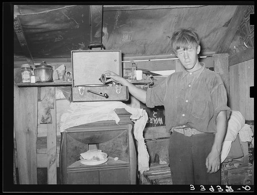 Untitled photo, possibly related to: Son of resident of camp near May's Avenue. Oklahoma City, Oklahoma. See general caption no. 21