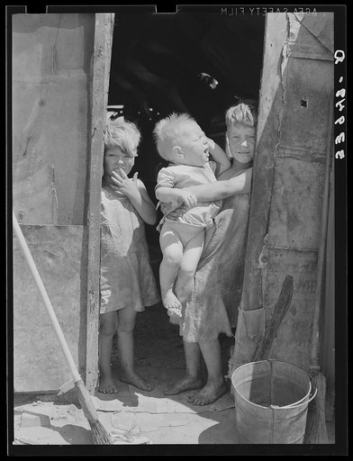 Untitled photo, possibly related to: Children of Mays Avenue camp dressed in old sacks. Their father is a "trasher." Oklahoma City, Oklahoma