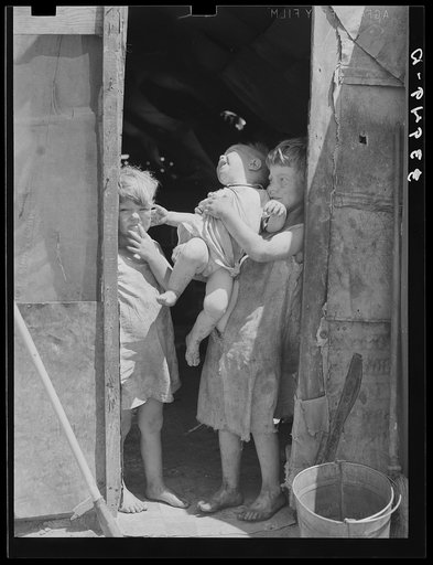 Children of Mays Avenue camp dressed in old sacks. Their father is a "trasher." Oklahoma City, Oklahoma