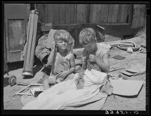 Children of Mays Avenue camp. Oklahoma City, Oklahoma. Their father is a trasher and they are playing with some things he picked up. See general caption no. 21