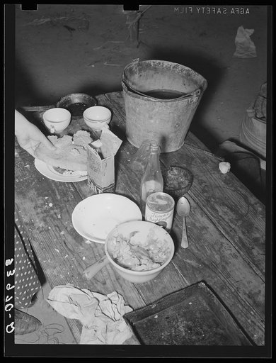 Food on table in community camp. Oklahoma City, Oklahoma. See general caption 21