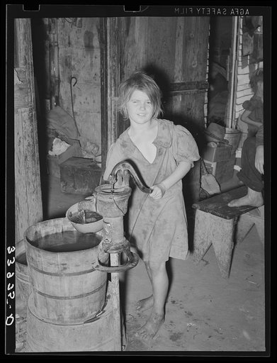 Child drawing water. Camp near Mays Avenue, Oklahoma City, Oklahoma. See general caption 21