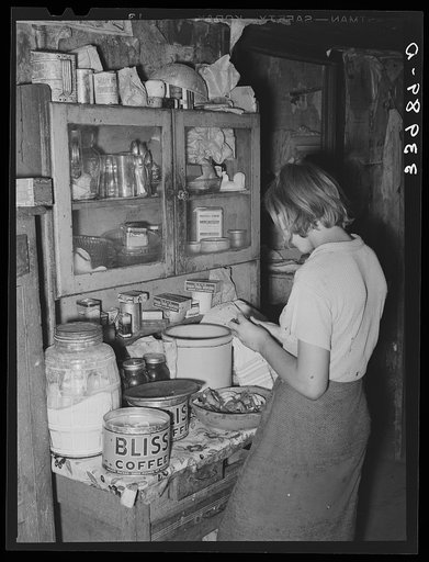 Daughter of tenant farmer peeling potatoes for noonday meal, near Muskogee, Oklahoma. See general caption 20