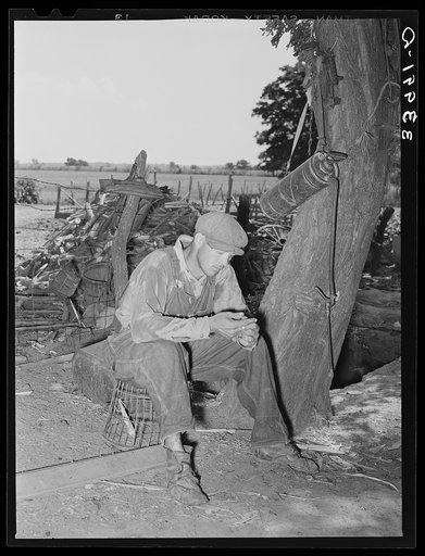 Son of tenant farmer in from fields. Notice sweated shirt. Near Muskogee, Oklahoma. See general caption 20