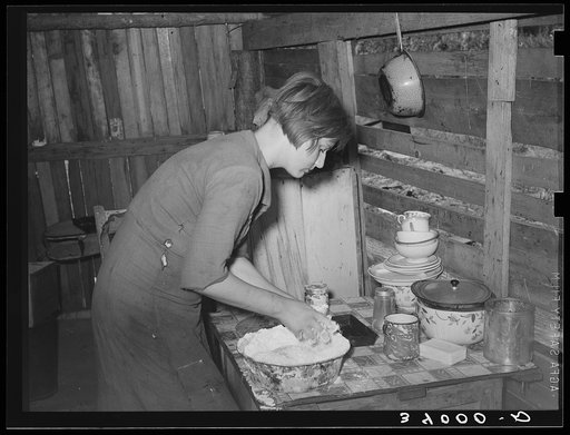 Resident of Mays Avenue camp making biscuits. Oklahoma City, Oklahoma. See general caption no. 21