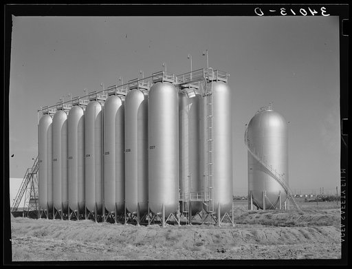 Untitled photo, possibly related to: Gas tanks in oil field. Oklahoma City, Oklahoma