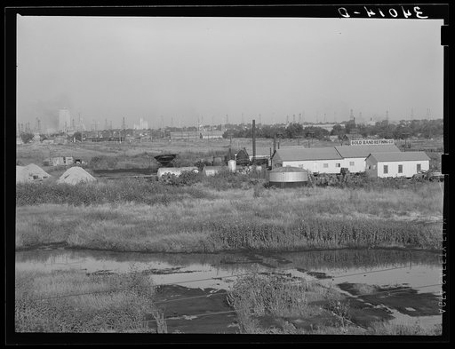 Untitled photo, possibly related to: Independent refinery. Business section of Oklahoma City, Oklahoma in background