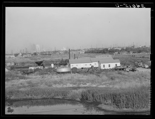 Independent refinery. Business section of Oklahoma City, Oklahoma in background