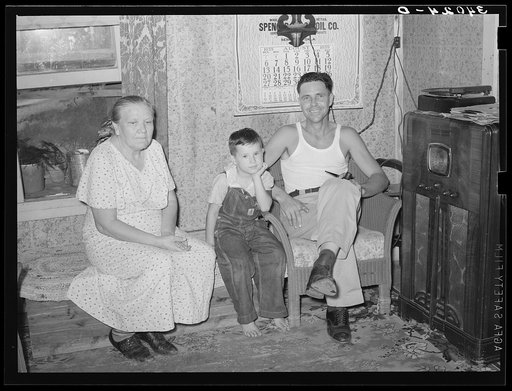 Truck driver, his mother and son at home. Seminole, Oklahoma, oil fields