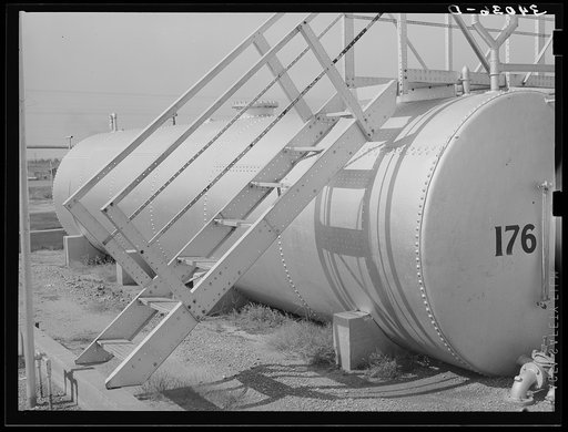 Seminole, Oklahoma. Storage tank and staircase of an oil refinery