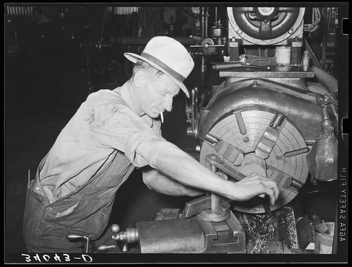 Machinist working at lathe. Seminole, Oklahoma, oil refinery