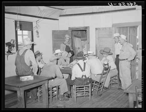 Game of dominoes in back room of bar. Saint Louis, Oklahoma. Oil field workers