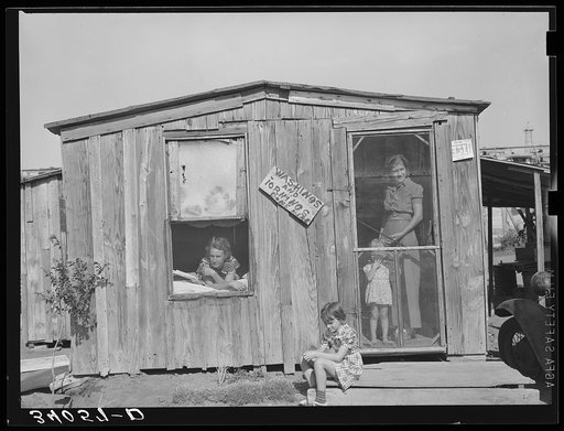Home and family of oil field roustabout. Oklahoma City, Oklahoma. During periods of unemployment the woman takes in washing and ironing