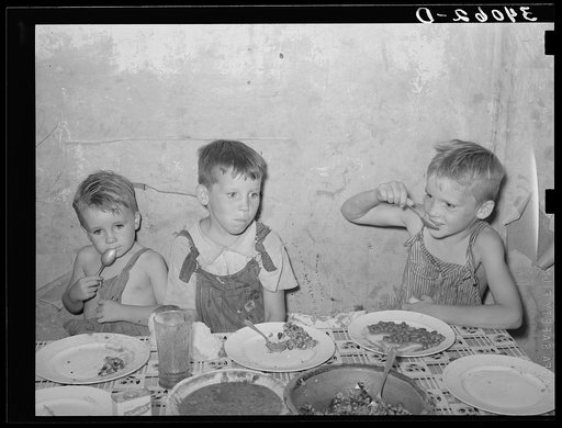 Children of unemployed oil worker eating supper. Seminole, Oklahoma