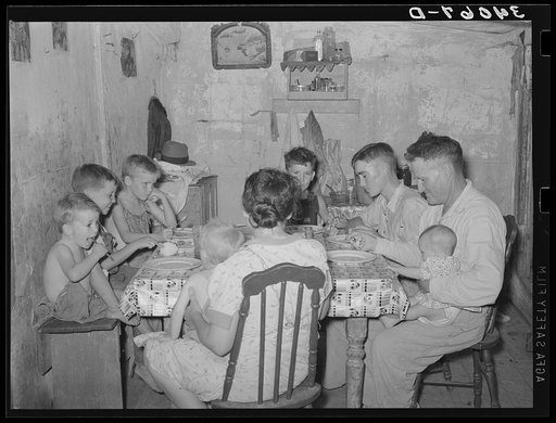 Family of unemployed oil worker, who is now living on relief, eating supper. Seminole, Oklahoma
