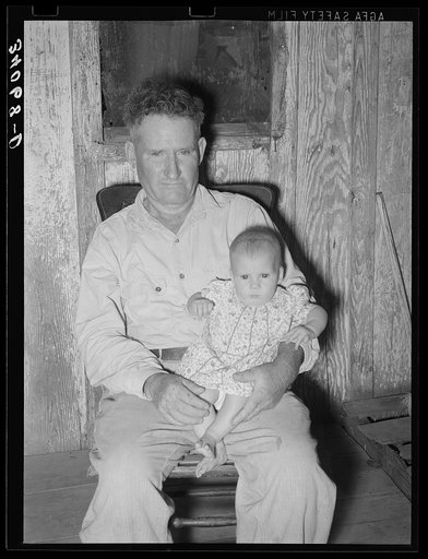 Unemployed oil worker and his baby. Seminole, Oklahoma