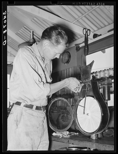 Recording thermometer repairman at oil refinery. Seminole, Oklahoma