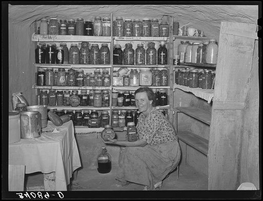 Mrs. Schoenfeldt, FSA (Farm Security Administration) client, in Sheridan County, Kansas, in fruit cellar