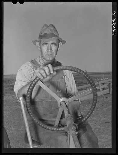 Mr. Germeroth, FSA (Farm Security Administration) client, at wheel of tractor which he bought with FSA loan. Sheridan County, Kansas