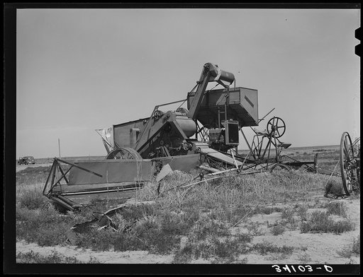 Old combine, unused for several years, near Cimarron, Kansas. Gray County