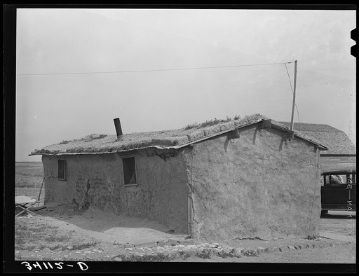 Sod house of the Schoenfeldts, FSA (Farm Security Administration) clients. Sheridan County, Kansas