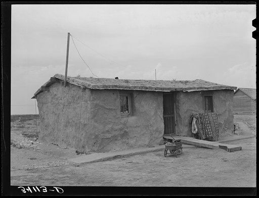 Sod house of the Schoenfeldts, FSA (Farm Security Administration) clients. Sheridan County, Kansas