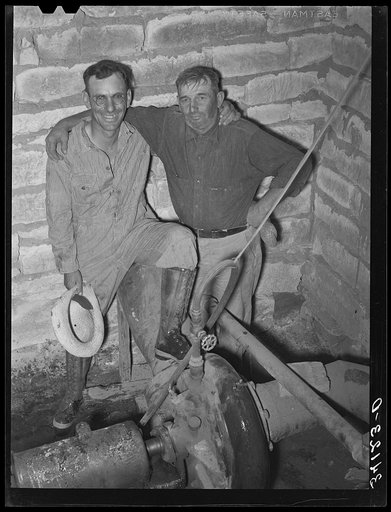 Mr. Johnson and Mr. Wright, owners and cooperators in irrigation well on farm near Syracuse, Kansas. They are FSA (Farm Security Administration) clients