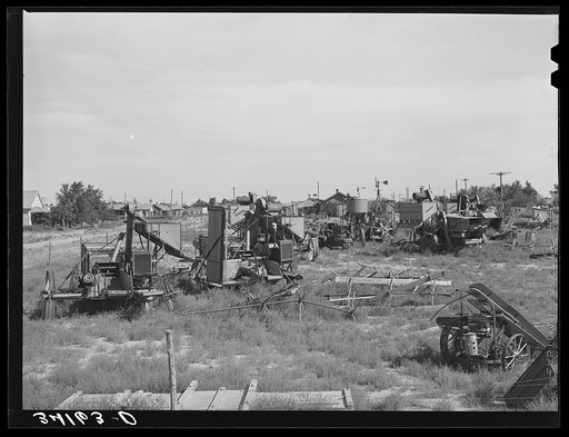 Repossessed combines in lot at Springfield. Baca County, Colorado