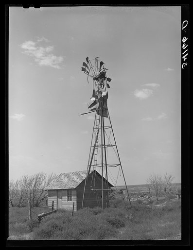 Old windmill and shed on abandoned farm near Syracuse, Kansas