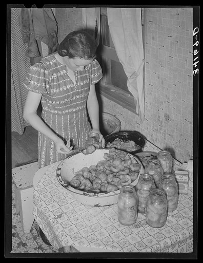 Canning peaches at the home of Mr. Bosley on his reorganization unit