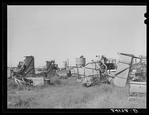Repossessed combines in lot at Springfield. Baca County, Colorado
