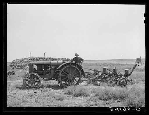 Untitled photo, possibly related to: Mr. Bosley on his tractor and planter on the Bosley reorganization unit. Baca County, Colorado