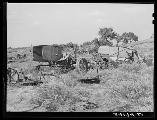 Junkyard of agricultural implements near Syracuse, Kansas