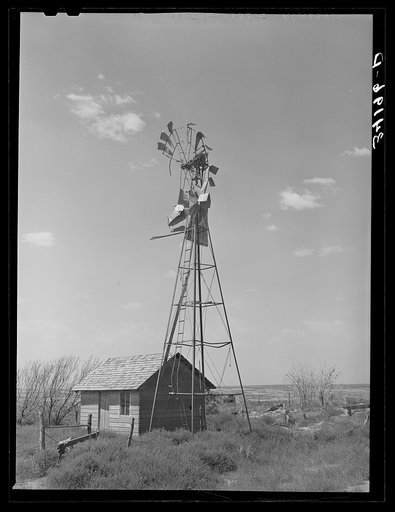 Untitled photo, possibly related to: Old windmill and shed on abandoned farm near Syracuse, Kansas