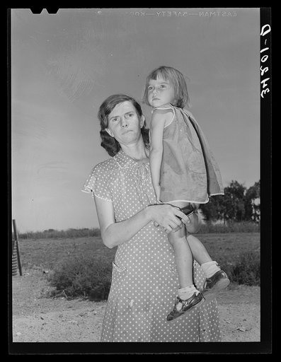 Mrs. Ernest W. Kirk Jr., wife of successful client, with her daughter on farm near Ordway, Colorado