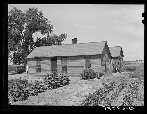 Home of Ernest W. Kirk Jr., FSA (Farm Security Administration) client near Ordway, Colorado. He runs an irrigated forty-acre farm which he rented from his landlord, a judge. His landlord is purchasing the eighty acres next to him, so that he may have 120 acres altogether
