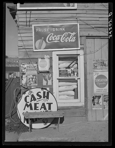 Detail of front of combined filling station and grocery store. Questa, New Mexico