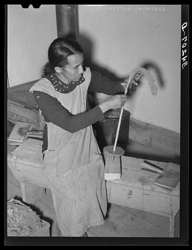 Spanish-American woman spinning woolen thread at WPA (Works Progress Administration/Work Projects Administration) project. Costilla, New Mexico