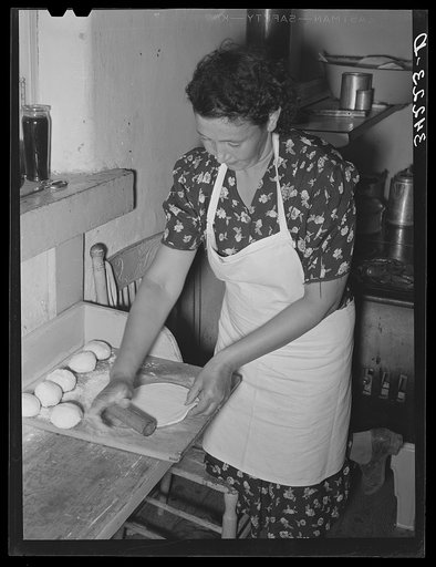 Spanish-American woman rolling out tortillas near Taos, New Mexico. Taos County