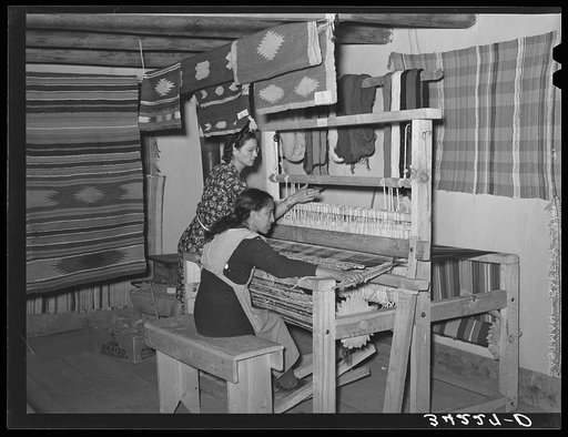 Spanish-American woman weaving a rag rug at WPA (Works Progress Administration/Work Projects Administration) project. Costilla, New Mexico
