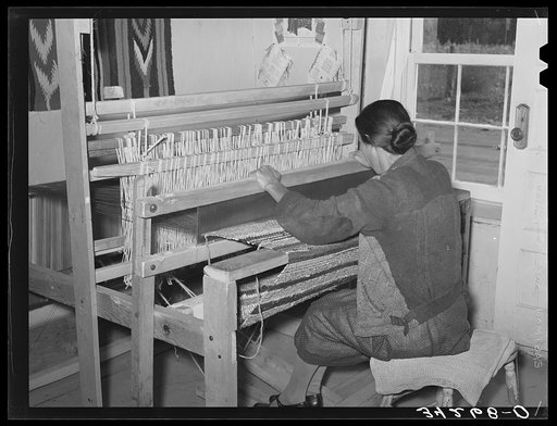 Weaving rag rug at WPA (Works Progress Administrrtion/Work Projects Administration) project. Costilla, New Mexico
