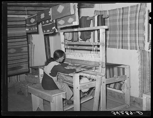 Spanish-American woman weaving rag rug at WPA (Works Progress Administration/Work Projects Administration) project. Costilla, New Mexico