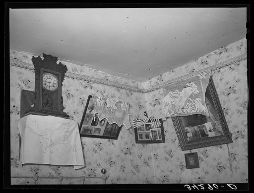 Corner of living room of Spanish-American family near Taos, New Mexico. Notice lace decorations
