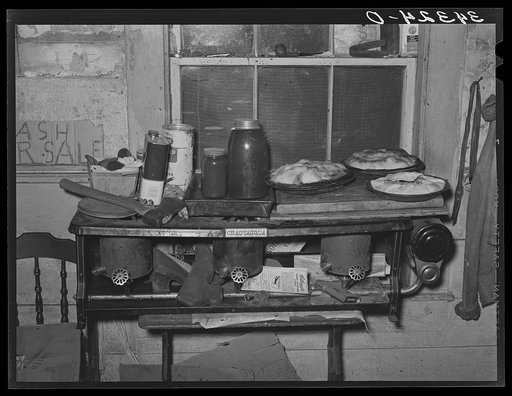 Pies, canned goods and household articles on stove in farm home. Bradford, Vermont, Orange County